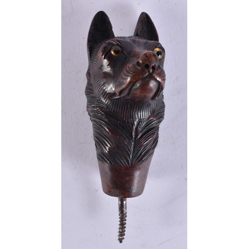 119 - A 19TH CENTURY BAVARIAN BLACK FOREST CARVED WOOD DOG CANE HANDLE. 9 cm long excluding screw.
