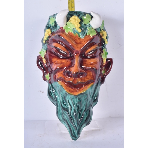 3289 - An Italian Majolica wall mask of Bacchus 24 x 15cm