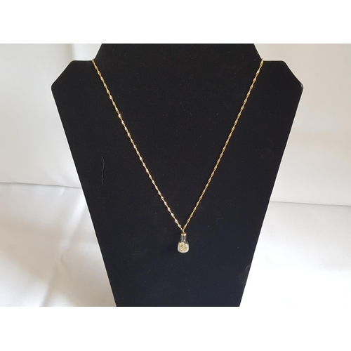 230 - 9ct gold chain with a bottle with gold flakes