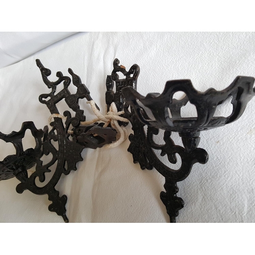 305 - pair of cast iron candle brackets