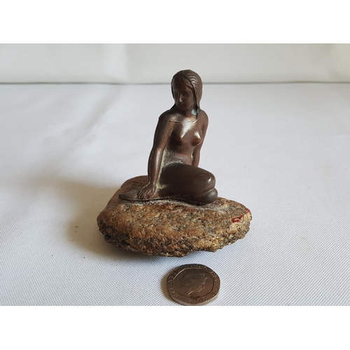 334 - bronzed lady on rock
