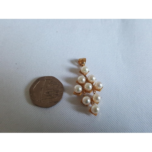 83 - 14ct gold & pearls pendant