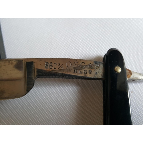 89 - boxed pair of Oscar razors