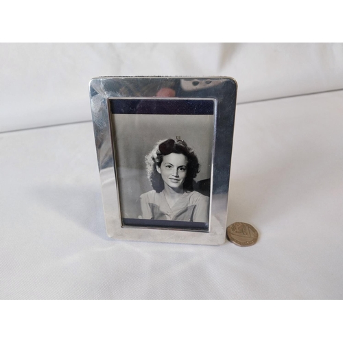 103 - HM silver oblong photo frame with stand c1926