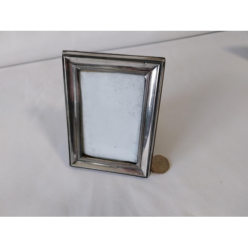 105 - HM silver oblong photo frame with stand c1918