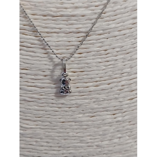 17 - 18ct white gold chain with a 14ct white gold teddy pendent