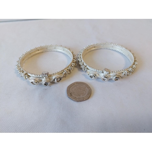 13 - pair of white metal bangles