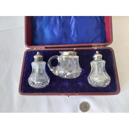 45 - HM silver topped cut glass cruet set c1910
