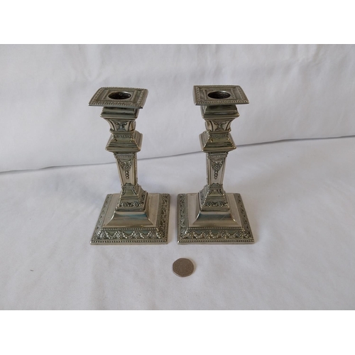 24 - pair of silver plated candlesticks