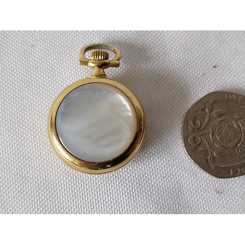 303 - miniature brass & mother of pearl pocket watch working order