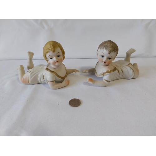 189 - pair of Porcelain Bisque Piano Baby