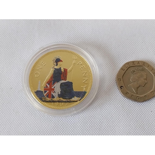 195 - gold plated & enamelled penny in capsule