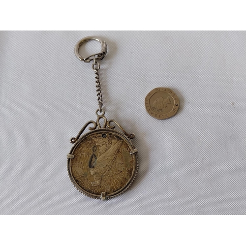 394 - HM silver keyring & surround with silver dollar c1925