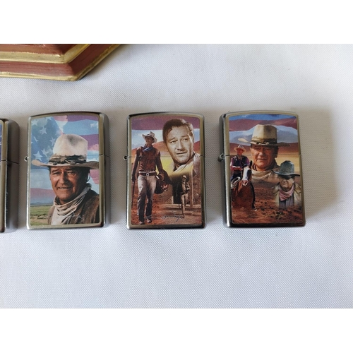 22 - 5 John Wayne Zippo lighters all unused with display stand (hand broken)