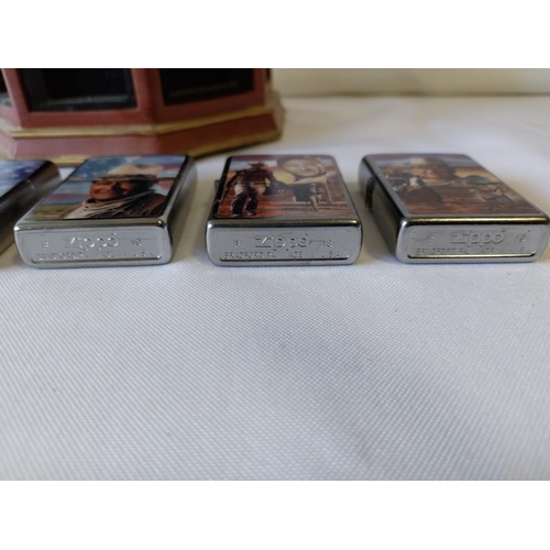 22 - 5 John Wayne Zippo lighters all unused with display stand (hand broken)