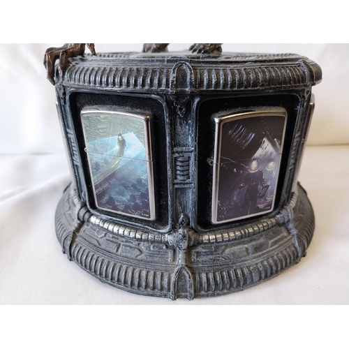 23 - 8 Alien Zippo lighters all unused with display stand (A/F)