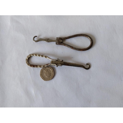 298 - 2 antique folding button hooks