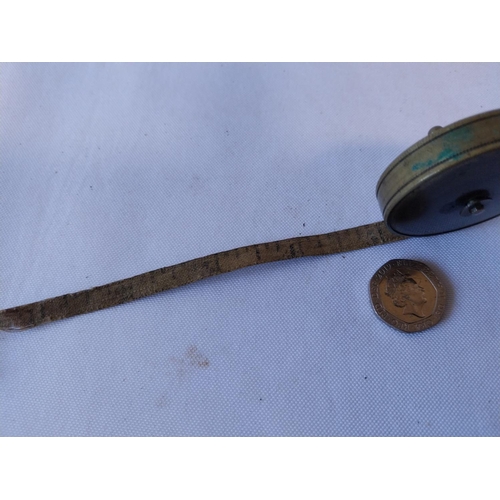 249 - small brass tape measure 12ft