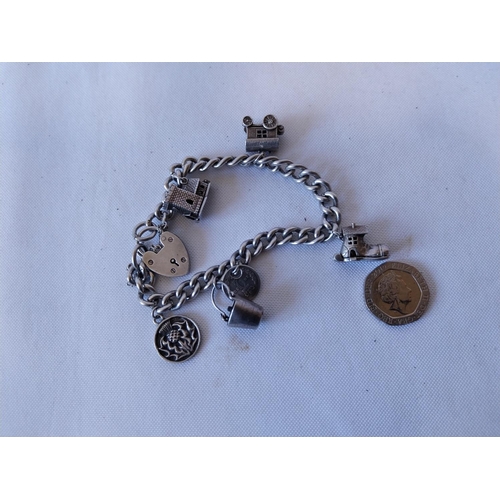 261 - HM Silver charm bracelet with opening charms