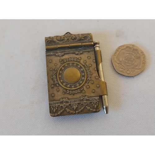 42 - brass antique notebook with pencil