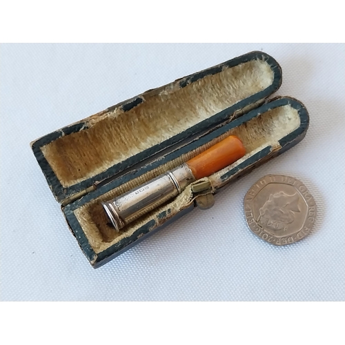 148 - HM Silver & amber cigarette holder in case c1920