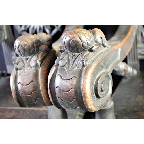 12 - PAIR HEAVILY CARVED THRONE CHAIRS WITH SUN FACE IN BACK PANELS OVER SOLID SEATS & SCROLL ARMS ON STR... 