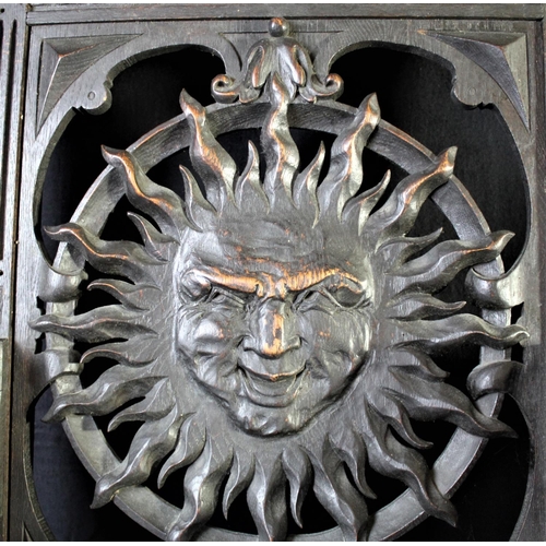 12 - PAIR HEAVILY CARVED THRONE CHAIRS WITH SUN FACE IN BACK PANELS OVER SOLID SEATS & SCROLL ARMS ON STR... 