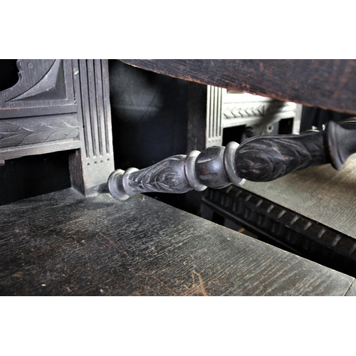 12 - PAIR HEAVILY CARVED THRONE CHAIRS WITH SUN FACE IN BACK PANELS OVER SOLID SEATS & SCROLL ARMS ON STR... 