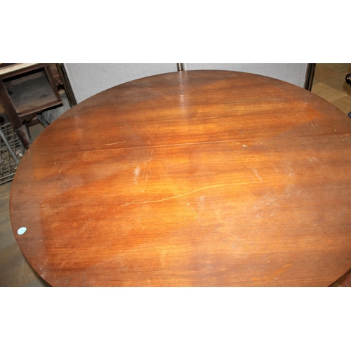 166 - TEAK CIRCULAR EXTENDING DINING TABLE BY AH McINTOSH