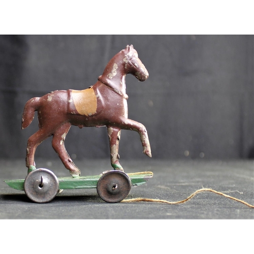 209 - VICTORIAN PULL-A-LONG TIN HORSE MADE IN CZECHOSLOVAKIA