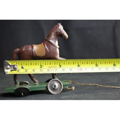 209 - VICTORIAN PULL-A-LONG TIN HORSE MADE IN CZECHOSLOVAKIA