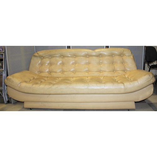 229 - CREAM VINYL STUDDED SOFA WITH CONVEX CURVE BASE (W74