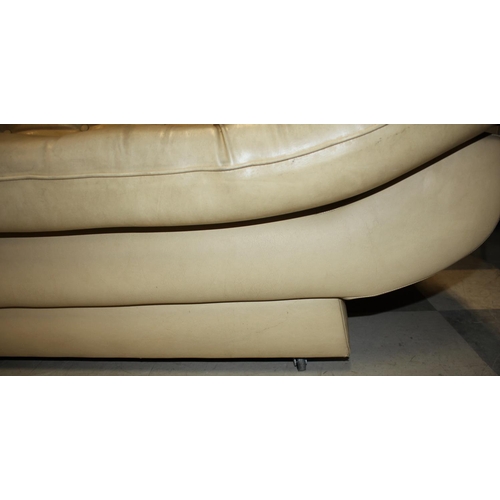 229 - CREAM VINYL STUDDED SOFA WITH CONVEX CURVE BASE (W74