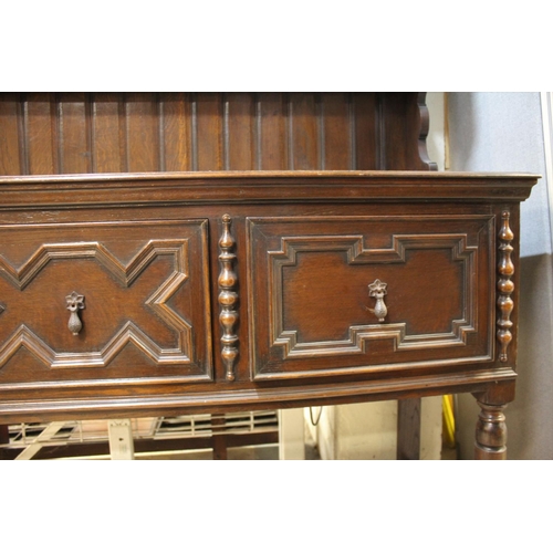 77 - OAK DRESSER WITH PLATE RACK BACK ON 3 DRAWER BASE RAISED ON TURNED LEGS (H69