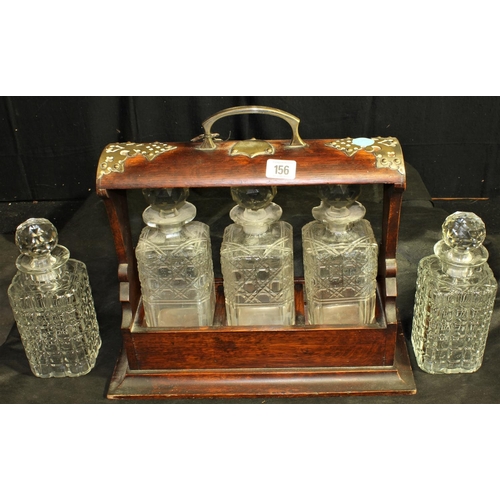 156 - TANTALUS WITH KEY & 5 CUT GLASS DECANTERS - 3 WITH DAMAGE