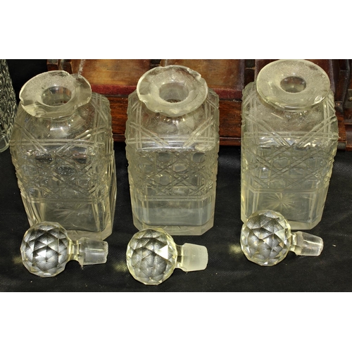 156 - TANTALUS WITH KEY & 5 CUT GLASS DECANTERS - 3 WITH DAMAGE