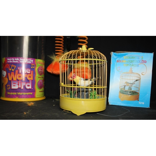 76 - SOUND CONTROLLED TOY BIRD'S CAGE (HANDLE SNAPPED) & THE WORD BIRD MUSICAL MARIONETTE (FREAKY DUCK)