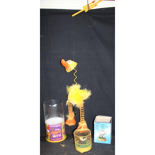 76 - SOUND CONTROLLED TOY BIRD'S CAGE (HANDLE SNAPPED) & THE WORD BIRD MUSICAL MARIONETTE (FREAKY DUCK)