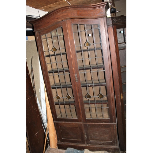 125 - OAK BOOKCASE WITH LEADLIGHT GLASS DOORS OVER 2 DOOR CUPBOARD BASE