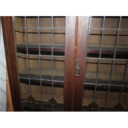 125 - OAK BOOKCASE WITH LEADLIGHT GLASS DOORS OVER 2 DOOR CUPBOARD BASE