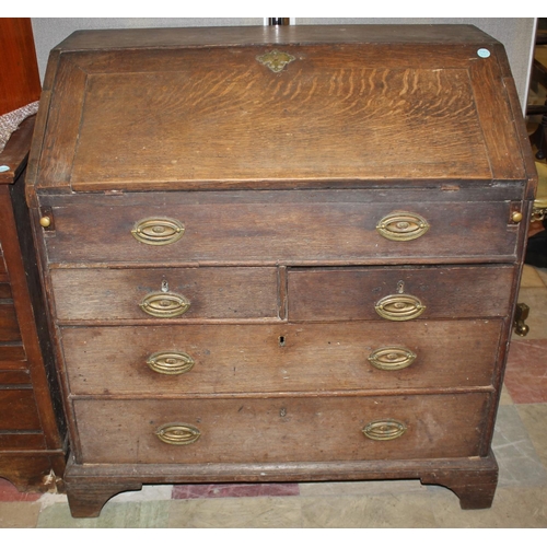 252 - LARGE GEORGIAN OAK BUREAU ON BRACKET FEET WITH BRASS DROP HANDLES