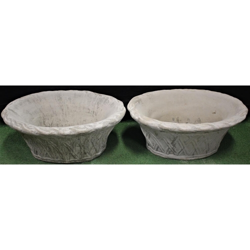 293 - PAIR OF OVAL STONEWORK GARDEN PLANTERS WITH WICKER BASKET EFFECT RELIEF