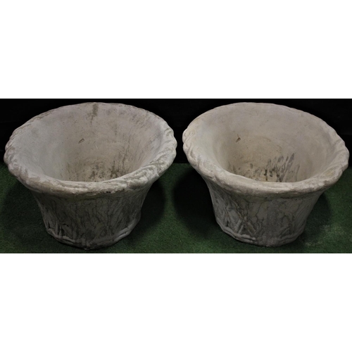 293 - PAIR OF OVAL STONEWORK GARDEN PLANTERS WITH WICKER BASKET EFFECT RELIEF