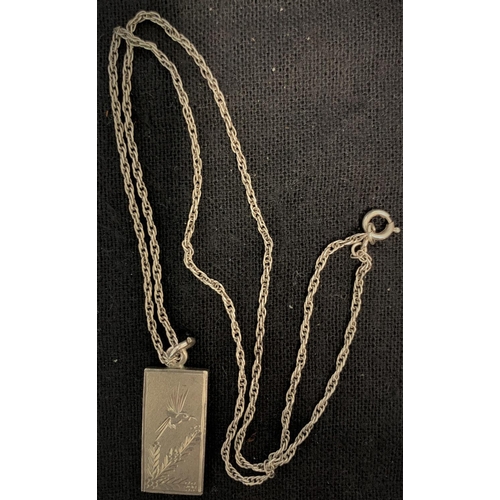 337 - SILVER INGOT WITH BIRD DECORATION ON SILVER COLOUR CHAIN