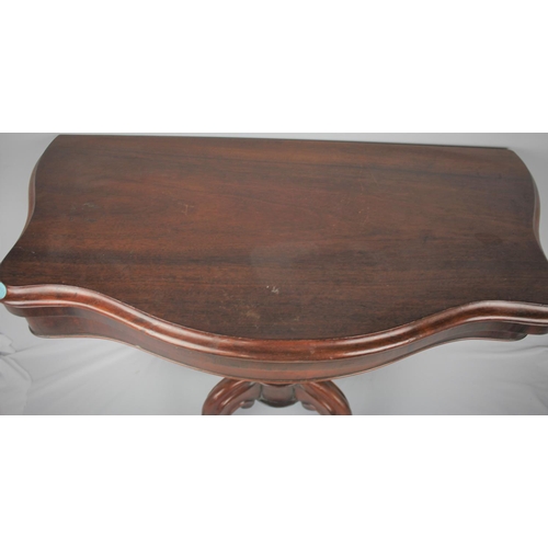 140 - MAHOGANY FOLD OVER CARD TABLE ON PEDESTAL BASE WITH SCROLLED LEGS