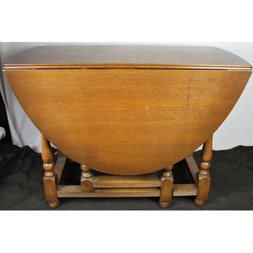 145 - OAK OVAL DROP-LEAF TABLE