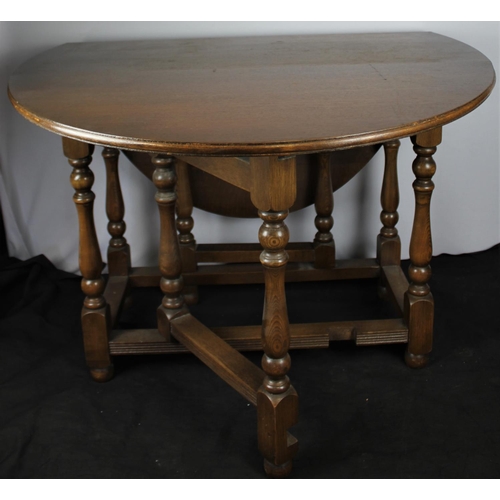 145 - OAK OVAL DROP-LEAF TABLE