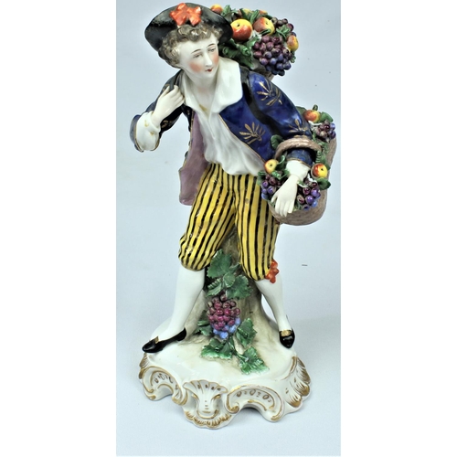 149 - PORCELAIN FIGURINE OF FRUIT SELLER - SOME DAMAGE