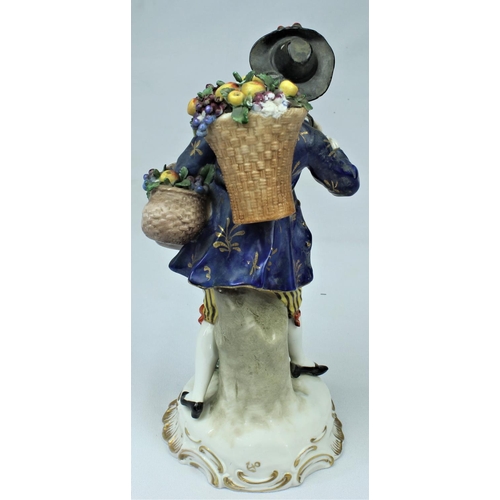 149 - PORCELAIN FIGURINE OF FRUIT SELLER - SOME DAMAGE