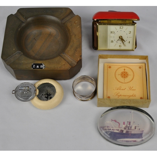 69 - TRANSPORT AND MARINE ASHTRAY, SILVER NAPKIN RING, PAPERWEIGHT, TRAVEL CLOCK AND TRAVEL ASHTRAY